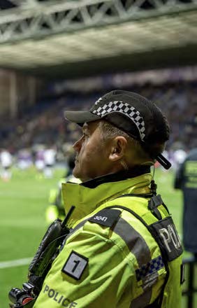 Policeman at football stadium